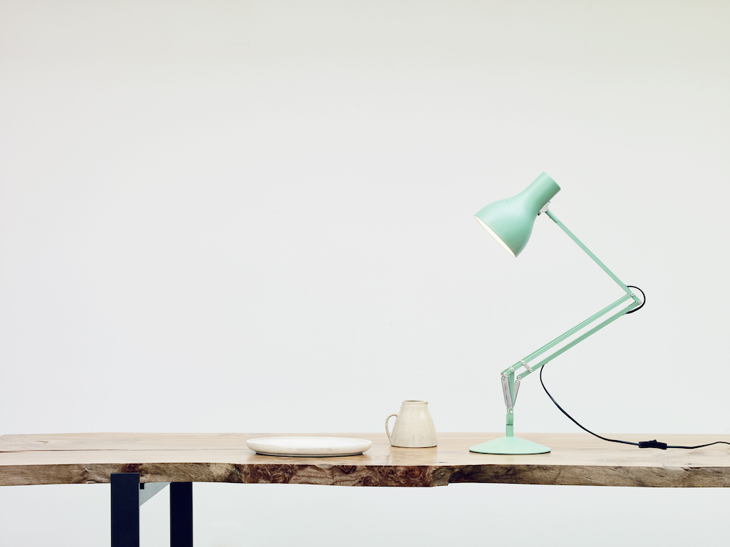 Maragret Howell light green desk lamp on wooden table 