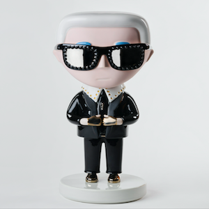 The Iconic Karl Lagerfeld; A statue Of a Man.